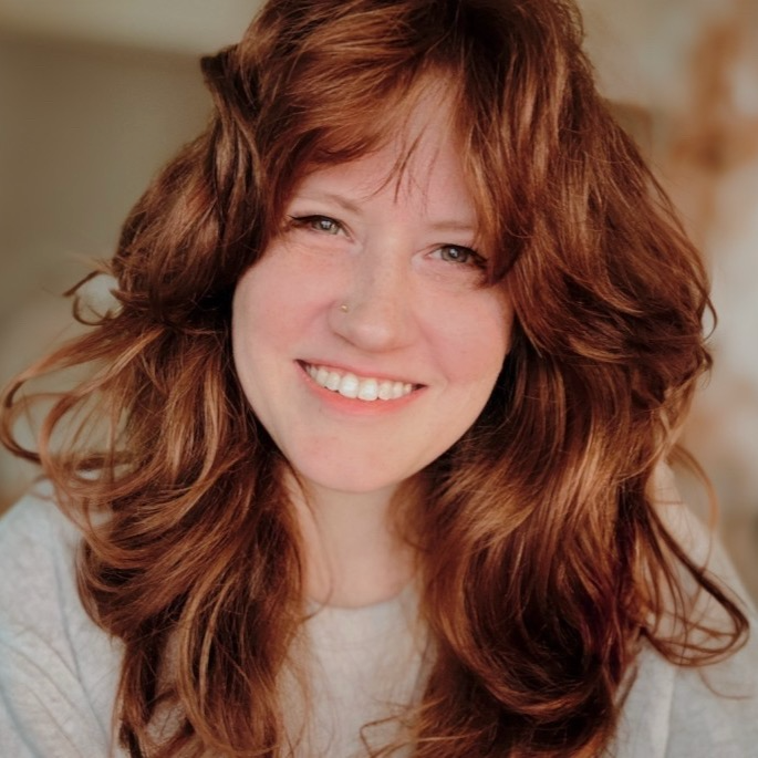 A photo of Cassondra Roberts, smiling and looking directly at the camera.
